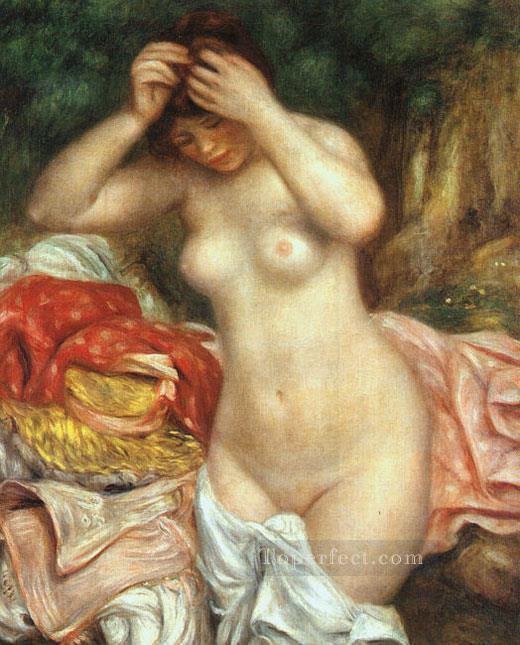 Bañista arreglando su cabello desnudo femenino Pierre Auguste Renoir Pintura al óleo